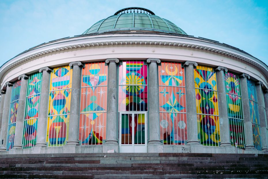 Colorful stained glass facade of Le Botanique in Brussels.