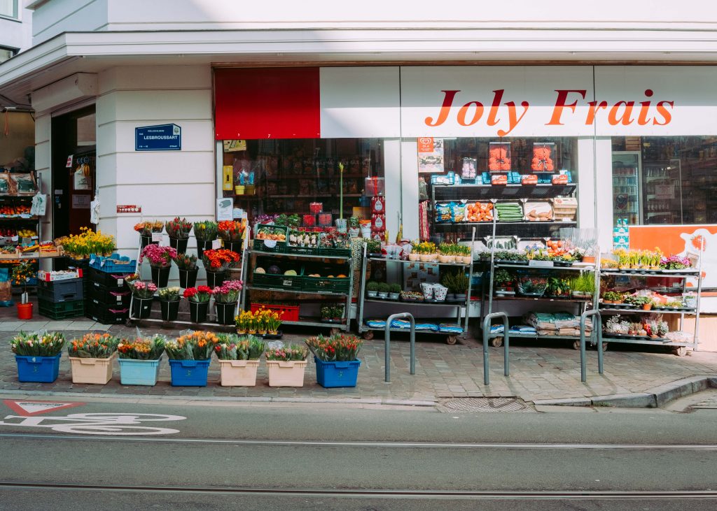 Joly Frais flower and produce shop with colorful flowers and vegetables on Lesbroussart Street in Ixelles Brussels