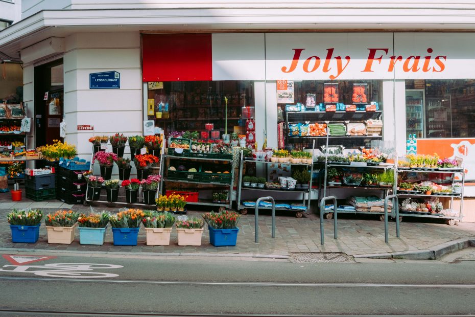 Joly Frais flower and produce shop with colorful flowers and vegetables on Lesbroussart Street in Ixelles Brussels