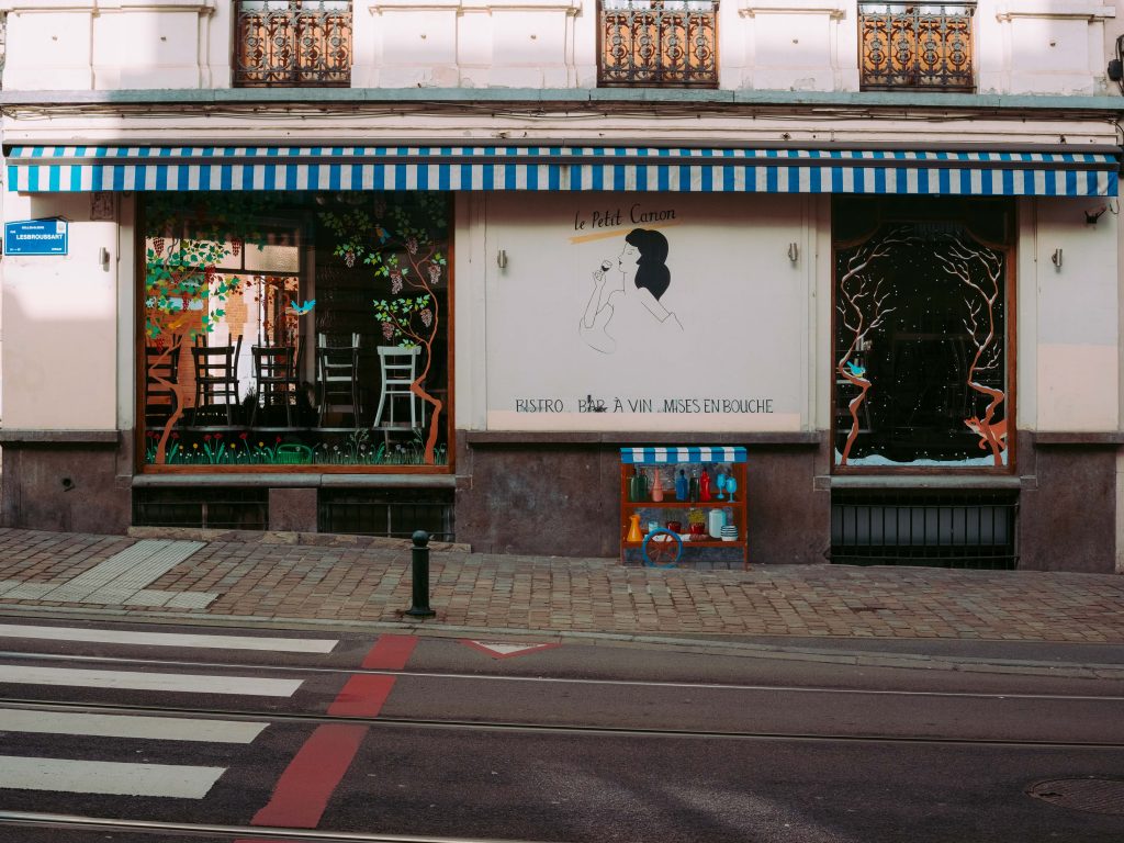 charming wine bar storefront with painted windows in Ixelles Brussels neighborhood