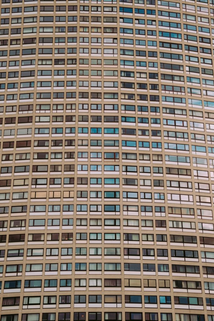 Grid of windows on a high-rise building in Brussels forming a structured geometric pattern